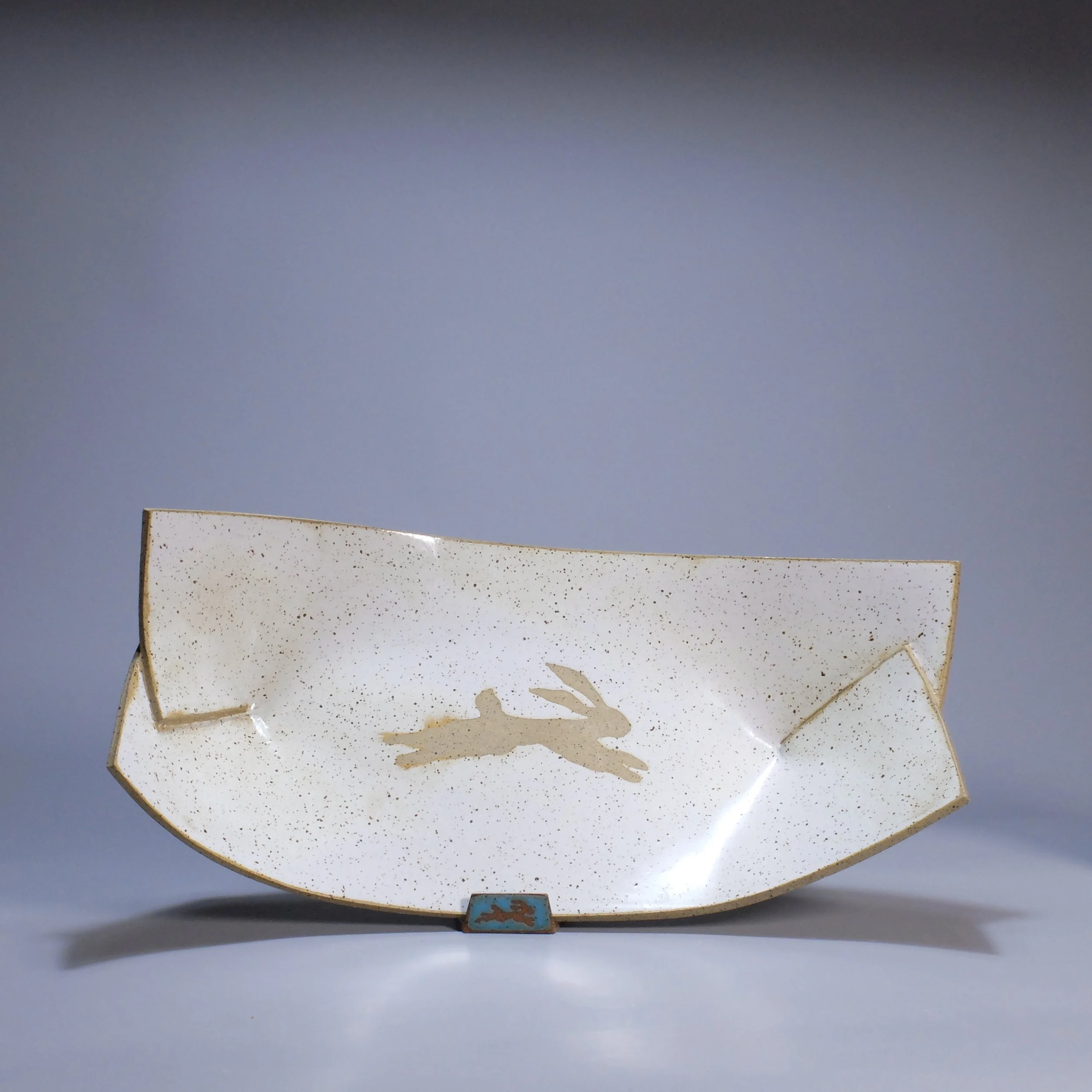 Big Boat, 2026. Speckled stoneware, white glaze, leaping hare motif. 16.5"L, 8.5"W, 5.25"D.