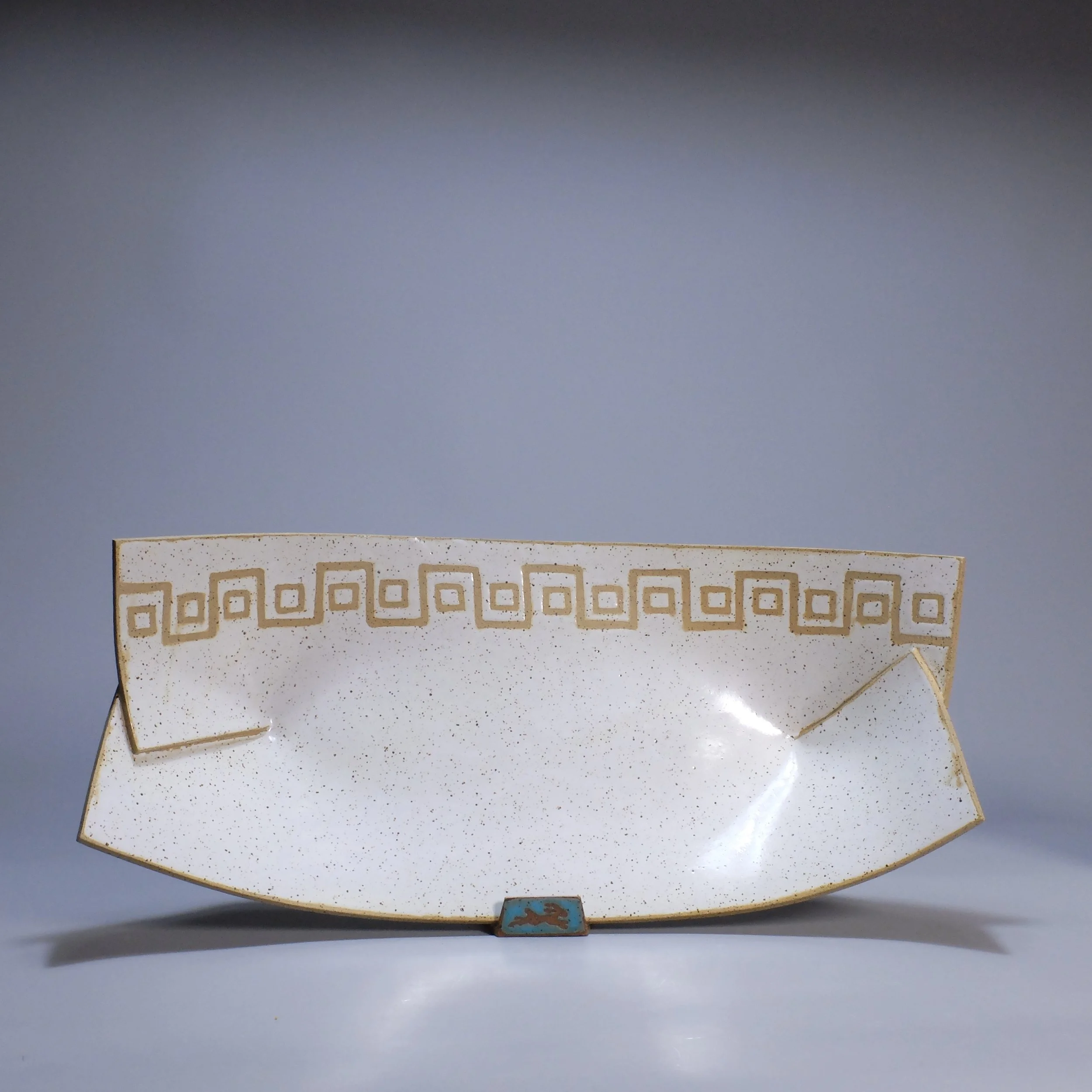 Big Boat, 2026. Speckled stoneware, white glaze, Greek-key inspired geometric motif. 16.5"L, 8.5"W, 5.25"D.