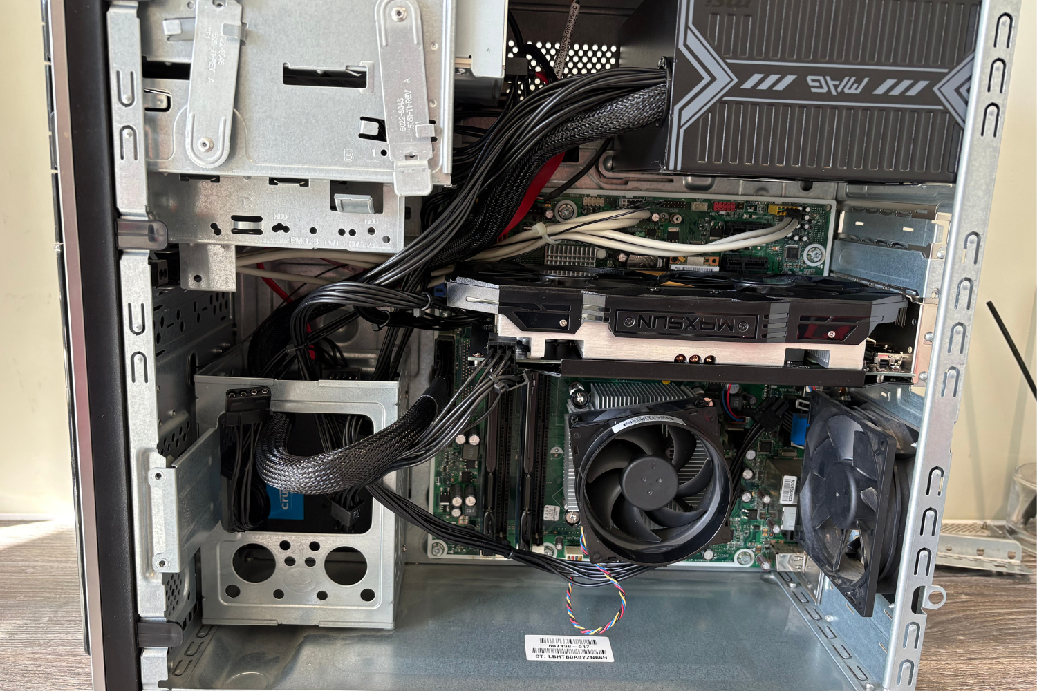 Interior of a custom built LaunchLayer desktop computer showing motherboard, graphics card, power supply, CPU fan, and various cables.