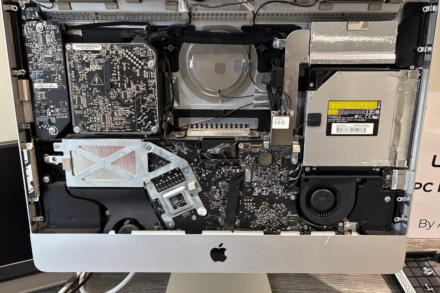 Interior view of an opened Apple iMac computer, showing an SSD upgrade in Wickford performed by LaunchLayer.