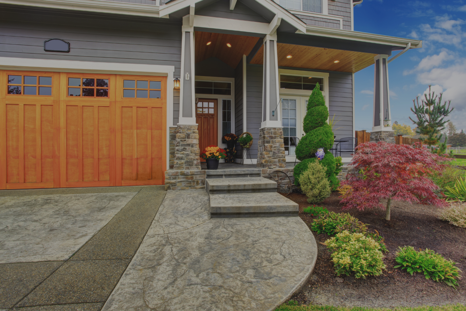Front exterior view of a well-kept home used to represent professional home selling services by Gillian Gooch Properties.