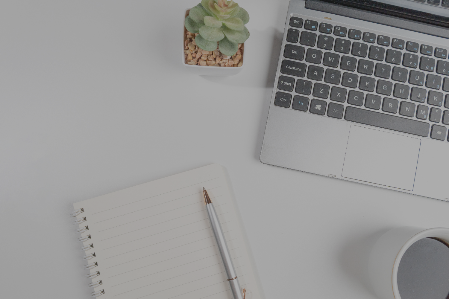 Laptop and checklist flat lay symbolizing homebuyer resources from Gillian Gooch Properties in Georgia and Florida.