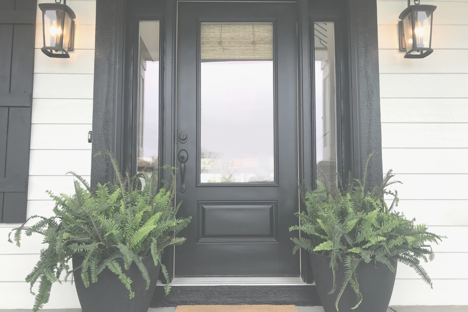 Luxury black front door of a modern Southern home symbolizing sophistication and welcoming entry — Gillian Gooch Properties Georgia real estate.