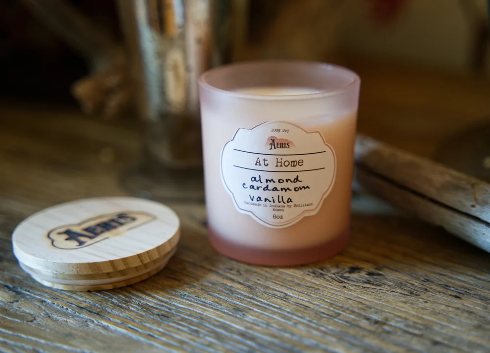 Frosted pink At Home candle with almond, cardamom and vanilla