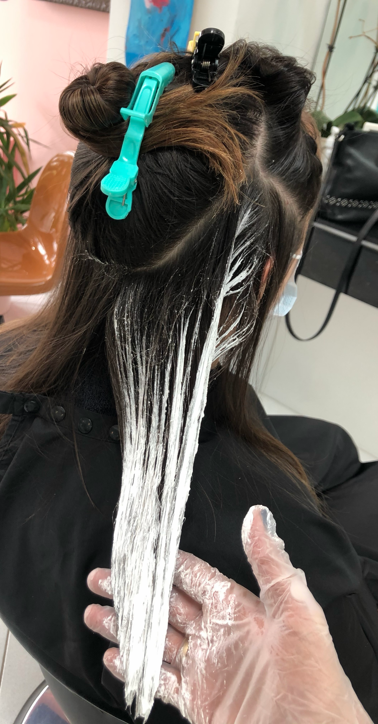 Stylist hand-painting balayage at Wish Salon