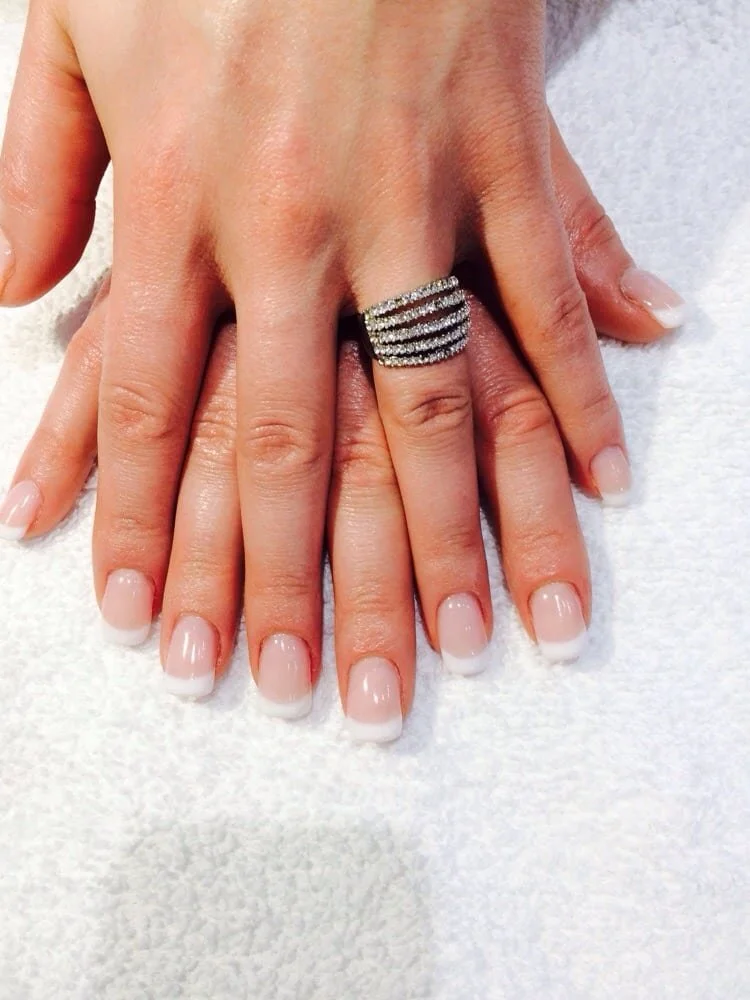Woman showing long french manicure