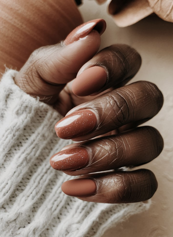 Earthy neutral colored manicure with soft metallic flake finish