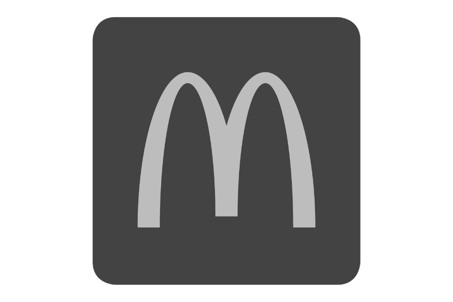Gray McDonald's logo on a dark background.