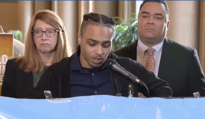 Son of Robert Brooks at Podium