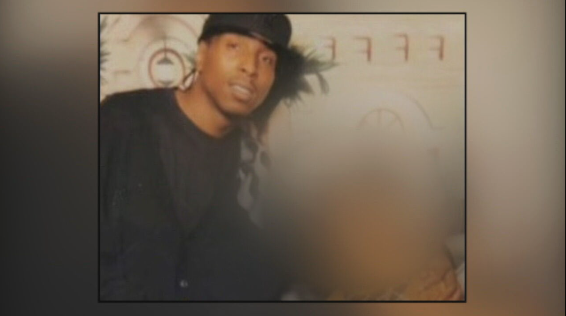 Robert Brooks wearing a black hat