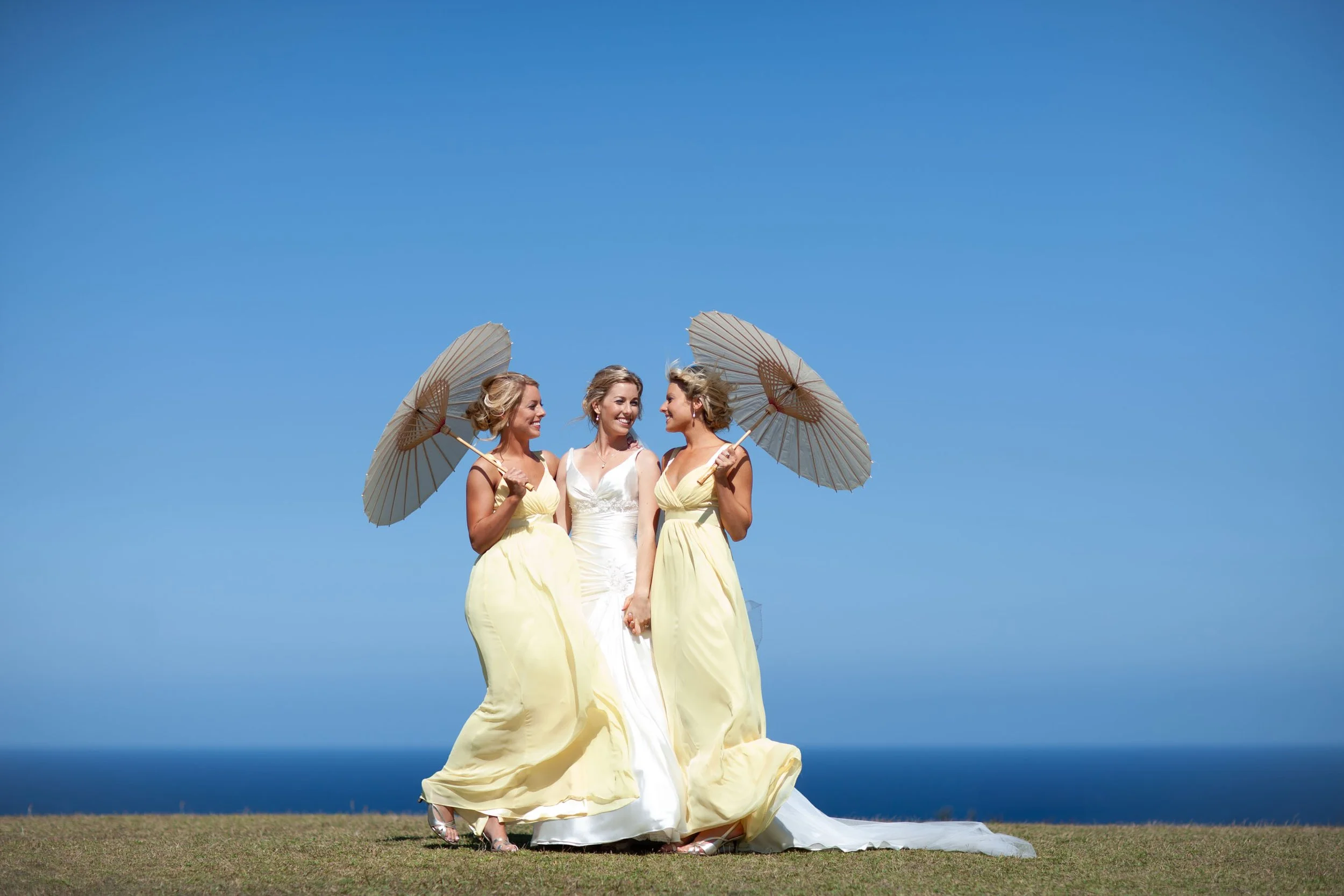 Bride Naomi smiling with her bridesmaid sisters at her wedding portraits in Vaucluse