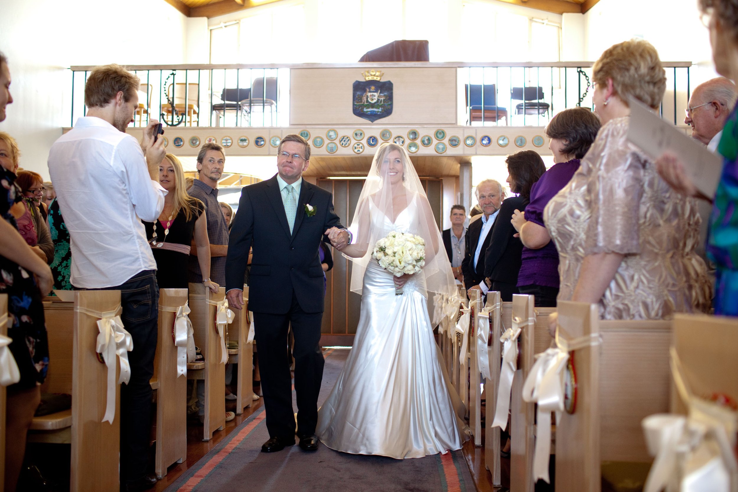 Bridal processional of Naomi with her emotional father at HMAS Watson Chapel