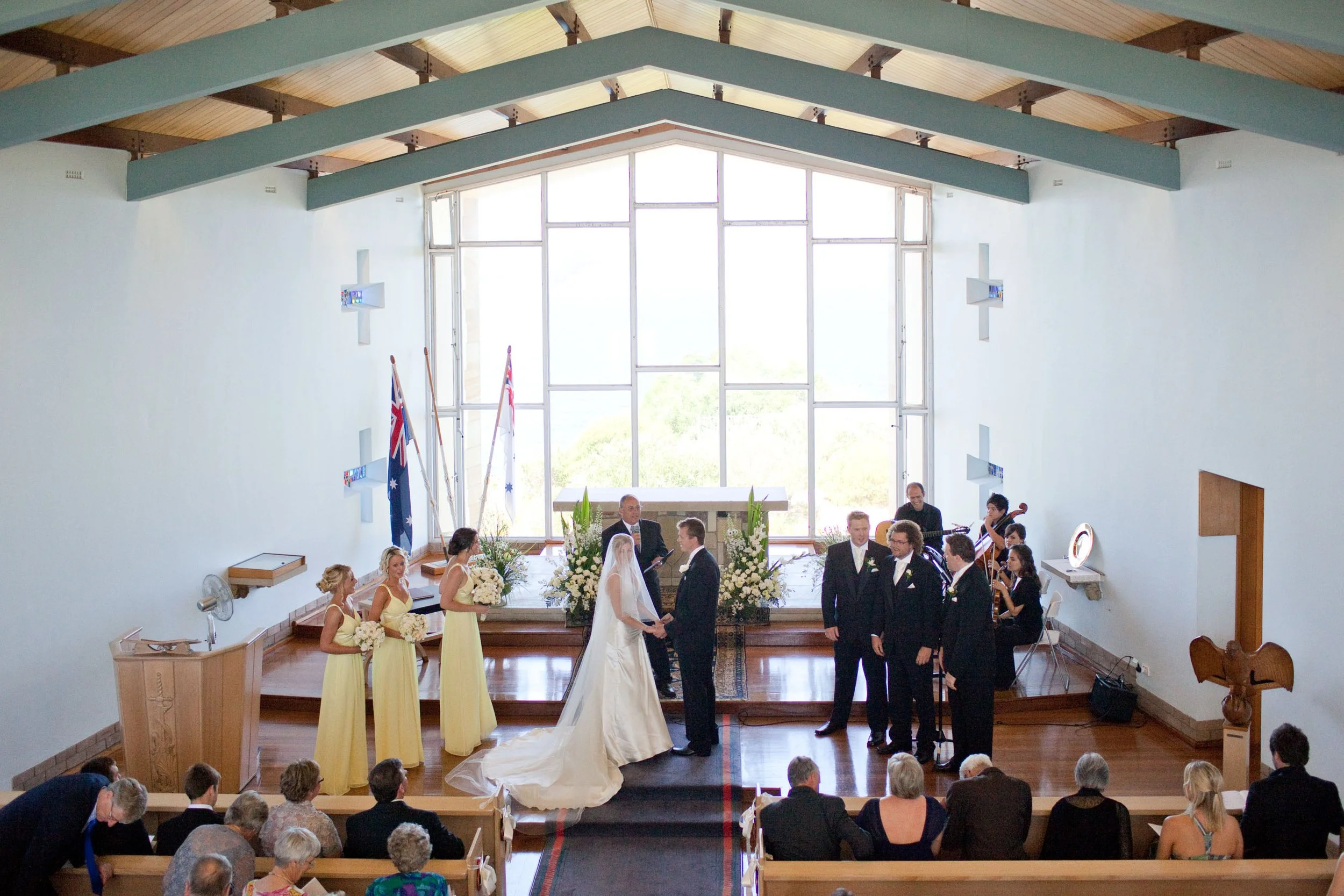 Exchanging vows inside HMAS Watson Chapel with Sydney Harbour in the background