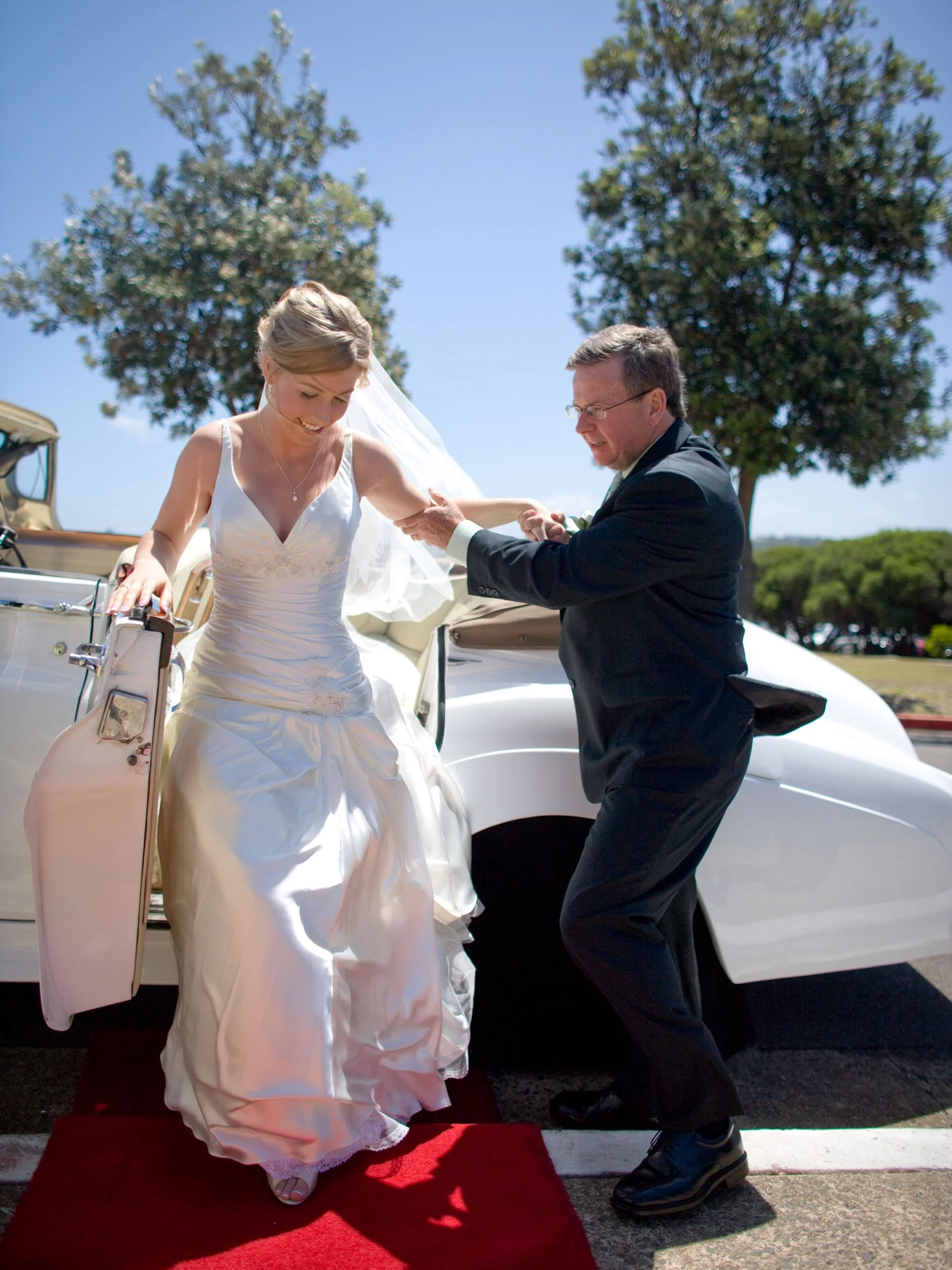 Naomi's father assists her from the car at HMAS Watson Chapel.
