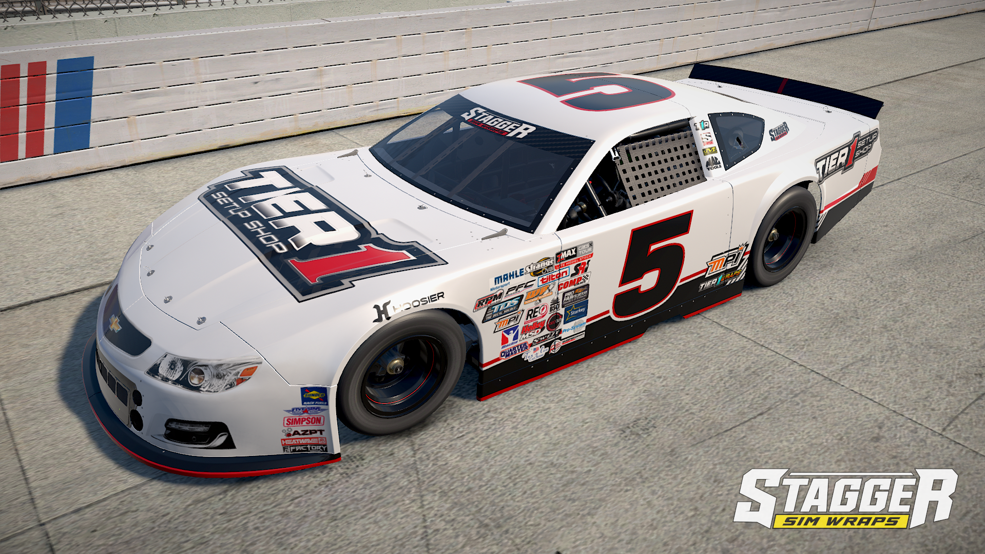 White race car with black, red, and red accents, large number 5 on side, and sponsor logos including 'Tier 1 Setup Shop' and 'Stagger'. It is parked on a race track next to a white fence with red and blue markings.