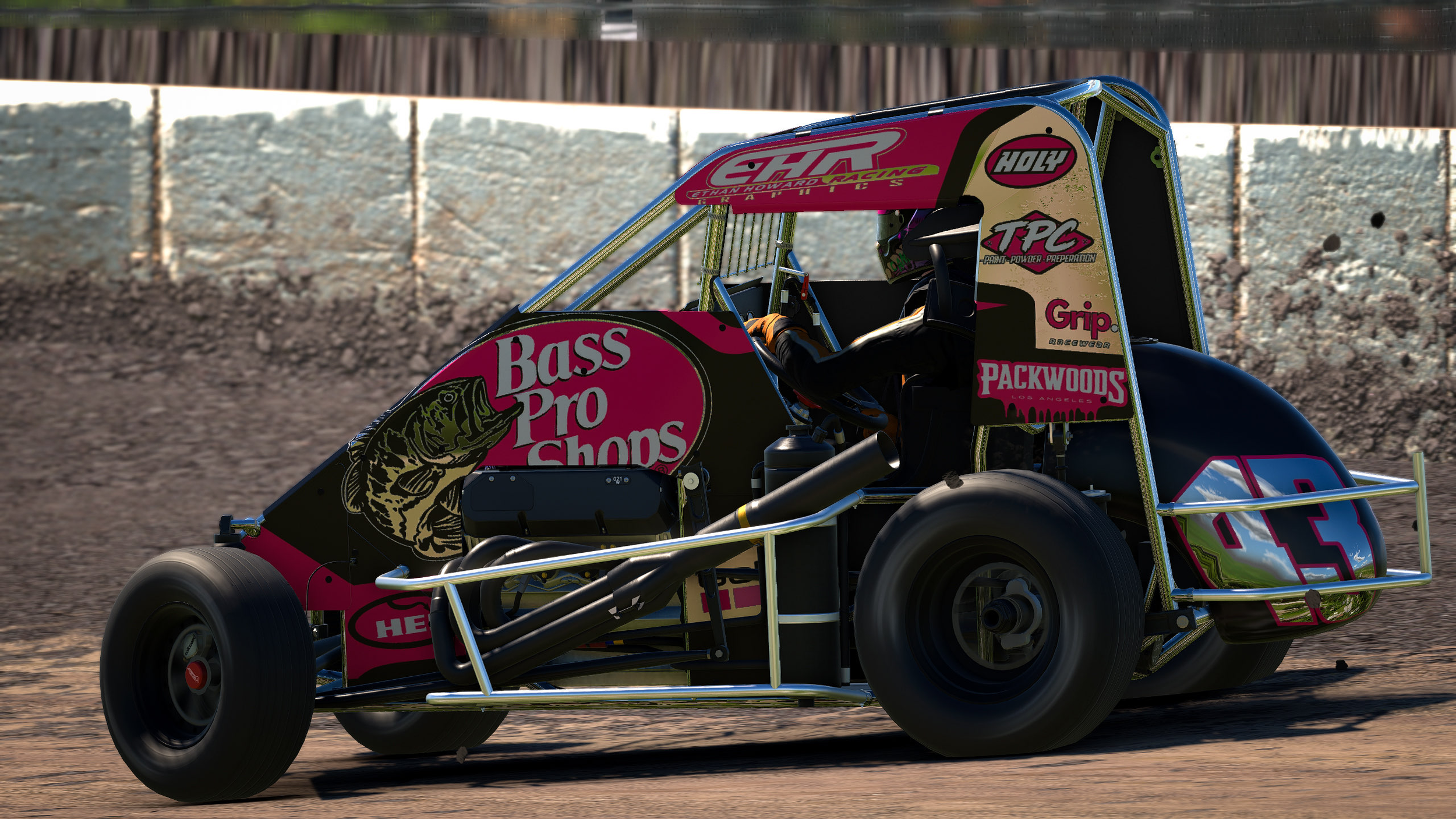 A race car speeding on a dirt track, featuring sponsor logos such as Bass Pro Shops, Holy, Packwoods, and Grip.