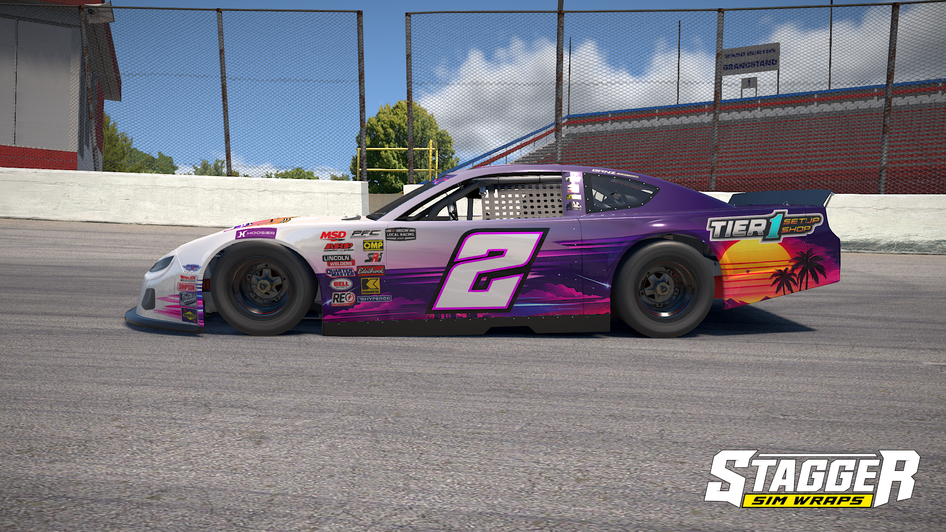A purple and pink race car with the number 2 on the side, parked on a race track. The car features a sunset and palm tree design on the rear. Various sponsorship decals are on the front and side, with a large 'TIER 1 SETUP SHOP' logo on the rear.