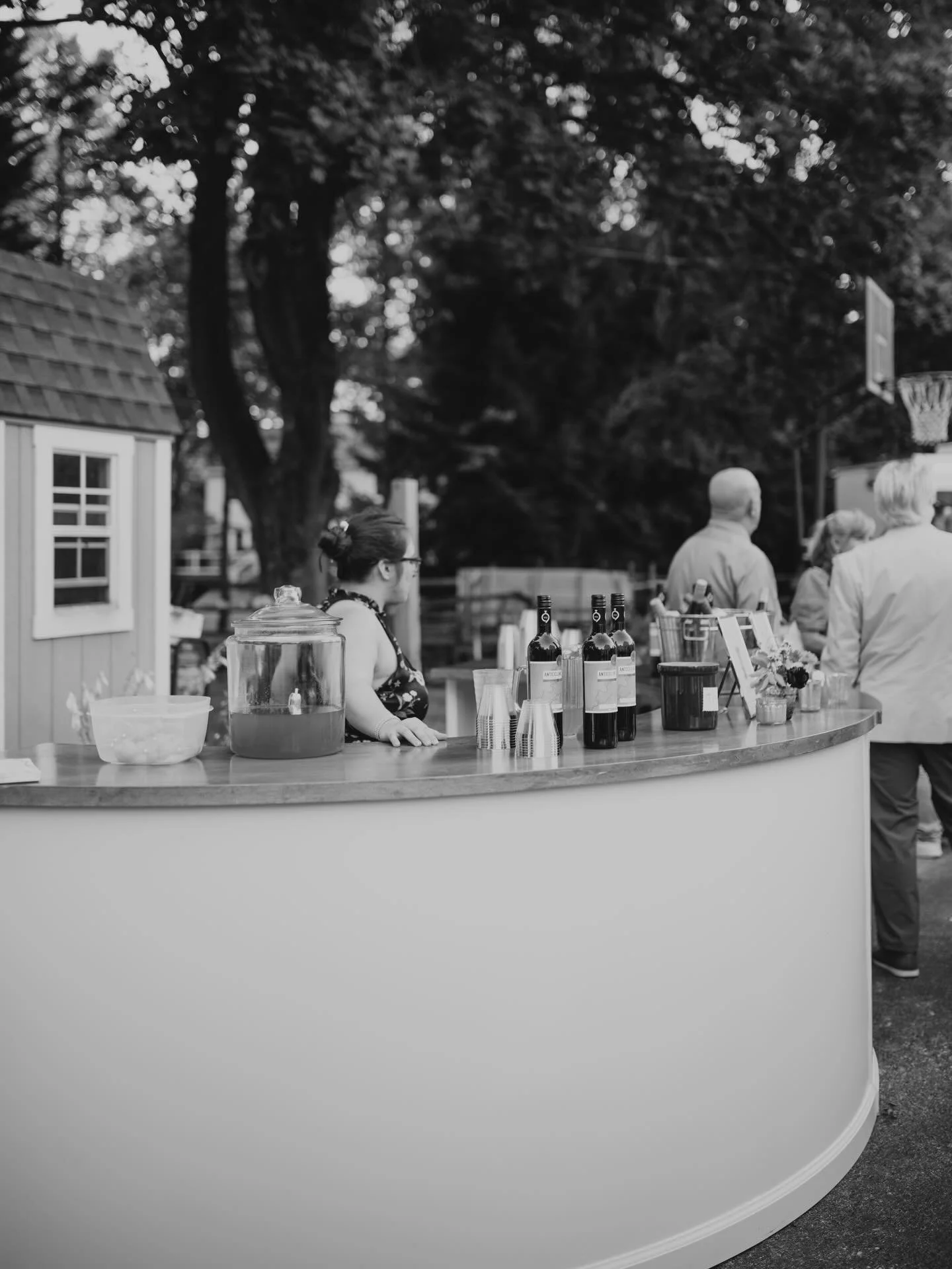 An elegant bar changes the entire feel of a space ✨
This is the place all of your guests will go throughout the night, why not make it memorable?

Our semi-circle bar features a soft ivory base, a richly stained wood top, and a graceful curved silhou