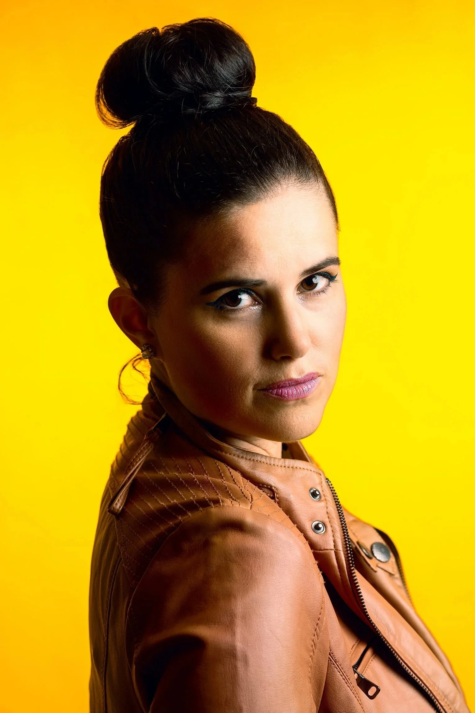 editorial studio portrait with bold yellow background – Calgary portrait photography