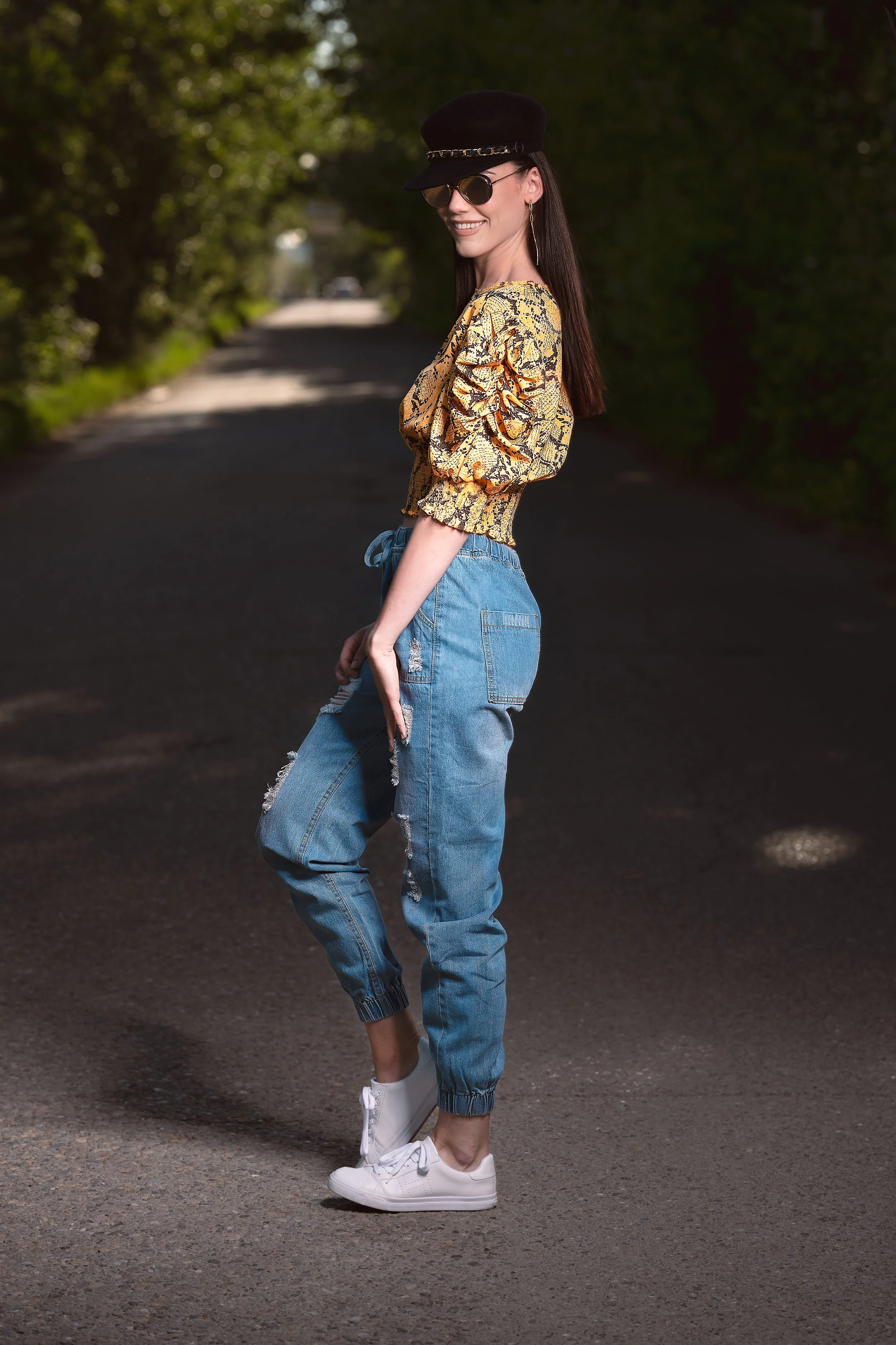 editorial fashion portrait of woman standing on shaded roadway – Calgary outdoor photography