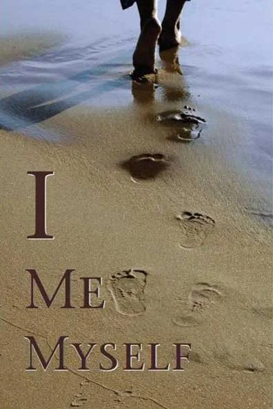 Footprints in the sand leading to a person walking near the water with the words "I Me Myself" vertically on the sandy beach.