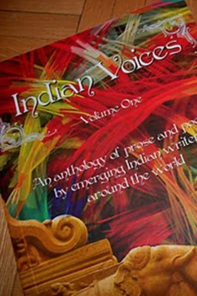 Book titled 'Indian Voices: An Anthology of prose and poetry' with colorful abstract background.