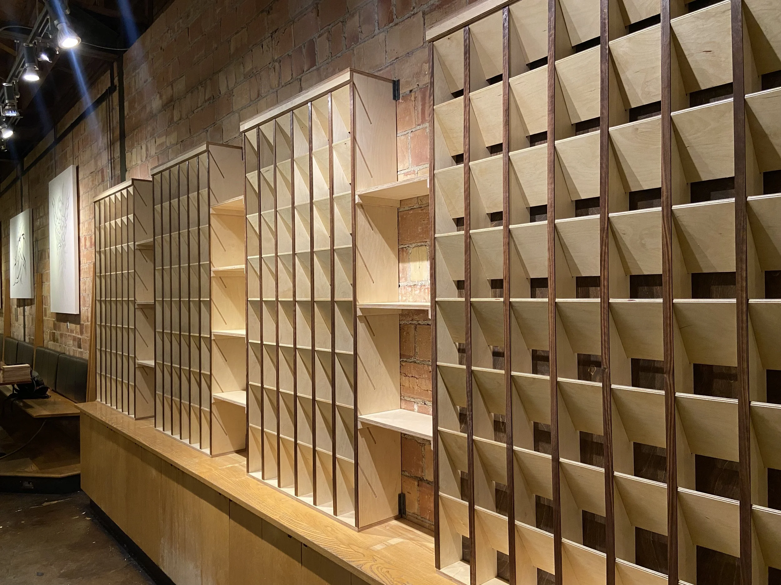 plywood and walnut coffee bag sorting shelves at coffee garden