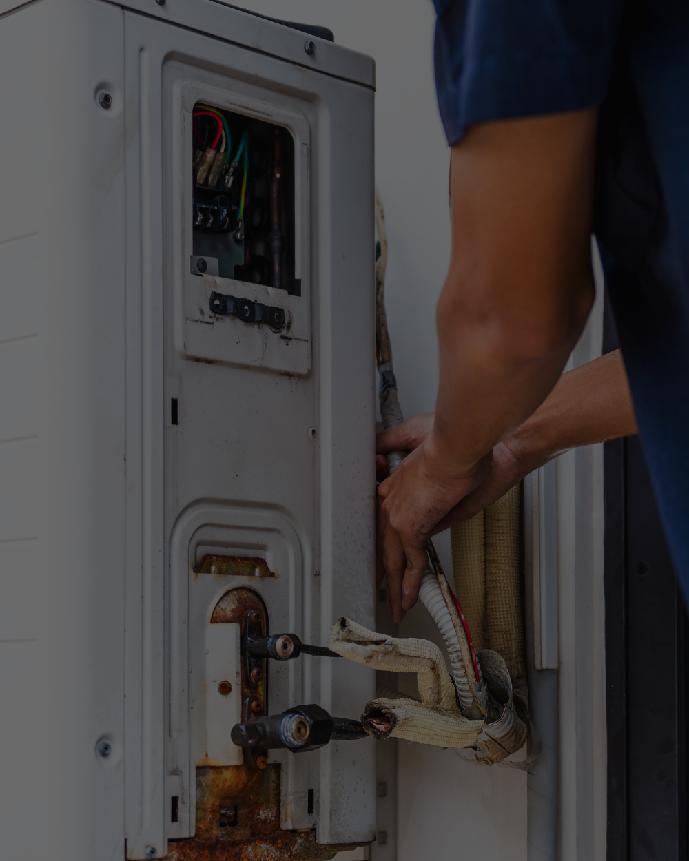 Technician performing routine maintenance on residential heating system