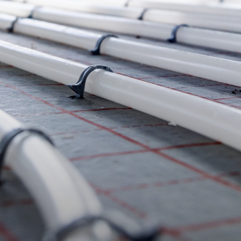 Hydronic radiant floor heating pipes installed in residential heating system