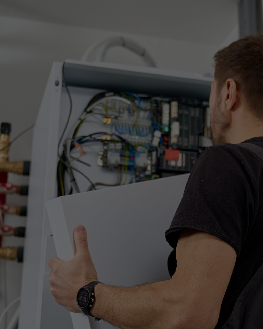 HVAC technician installing mechanical heating equipment