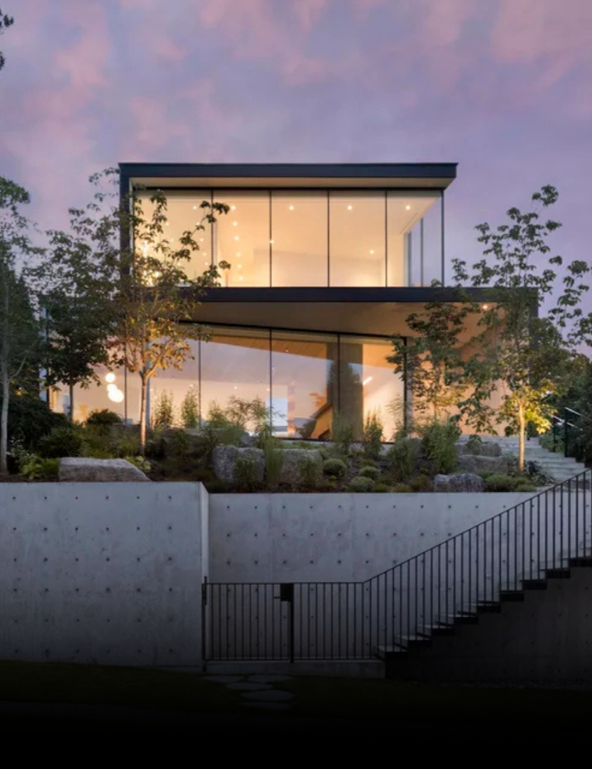 Modern custom residential home with large glass windows and contemporary architecture