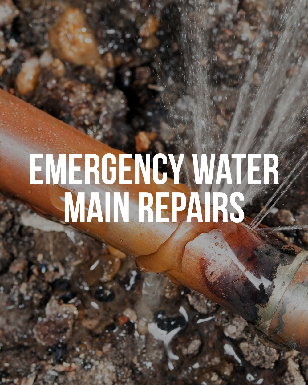 Damaged underground water main pipe leaking water during repair