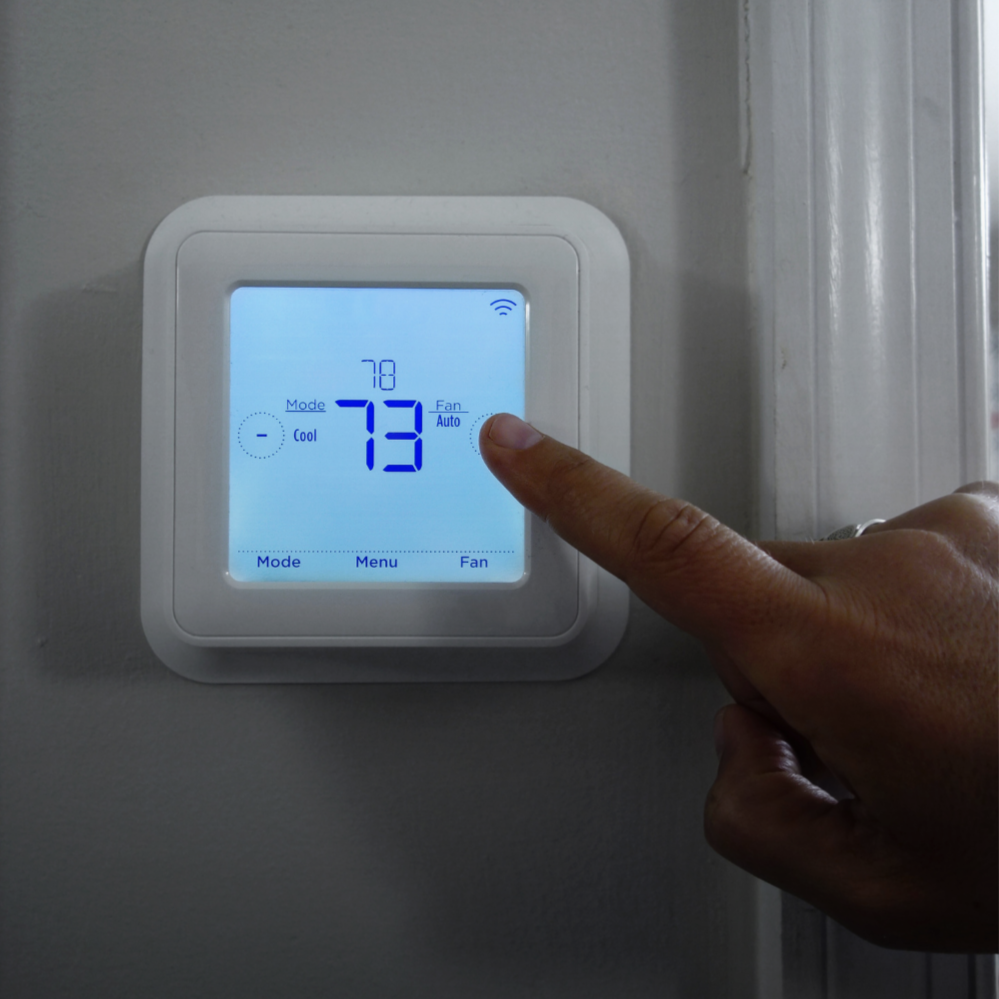 Smart thermostat controlling residential heating and cooling system installed by VanMech Mechanical