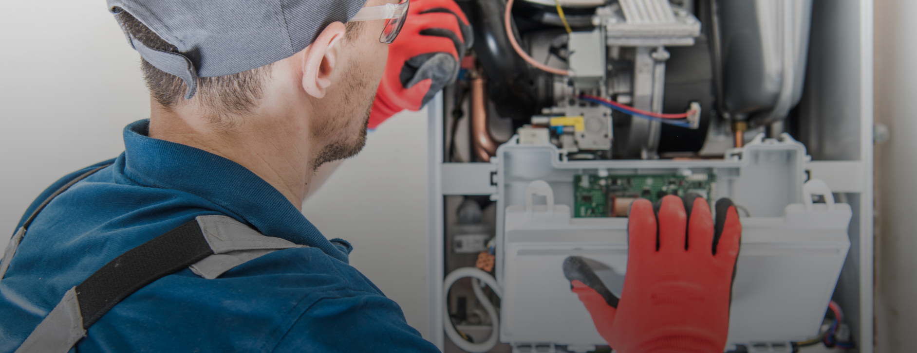 HVAC technician inspecting furnace components during heating system repair