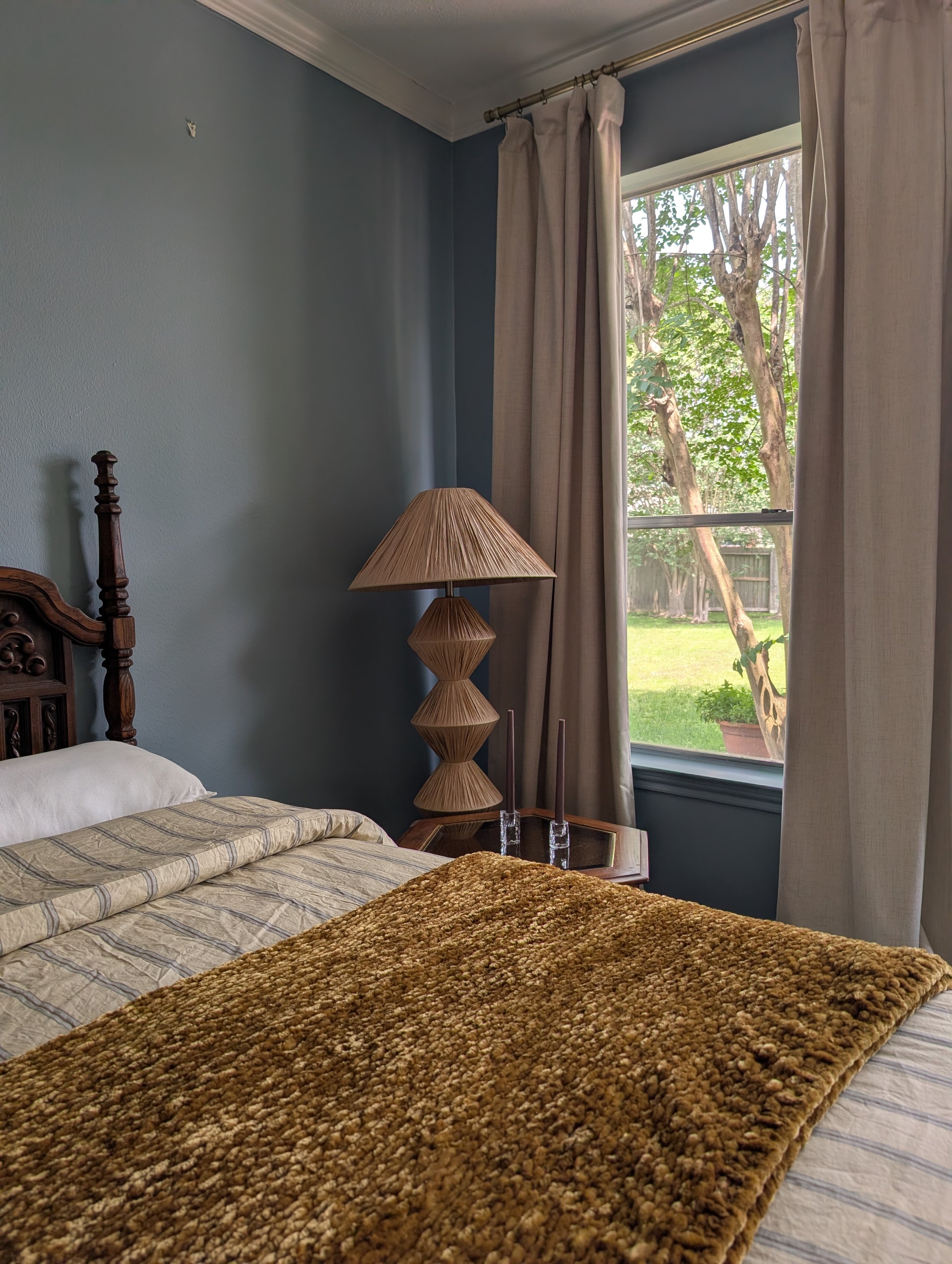 Matiz project primary bedroom featuring a meditative blue paint color palette and vintage furniture.