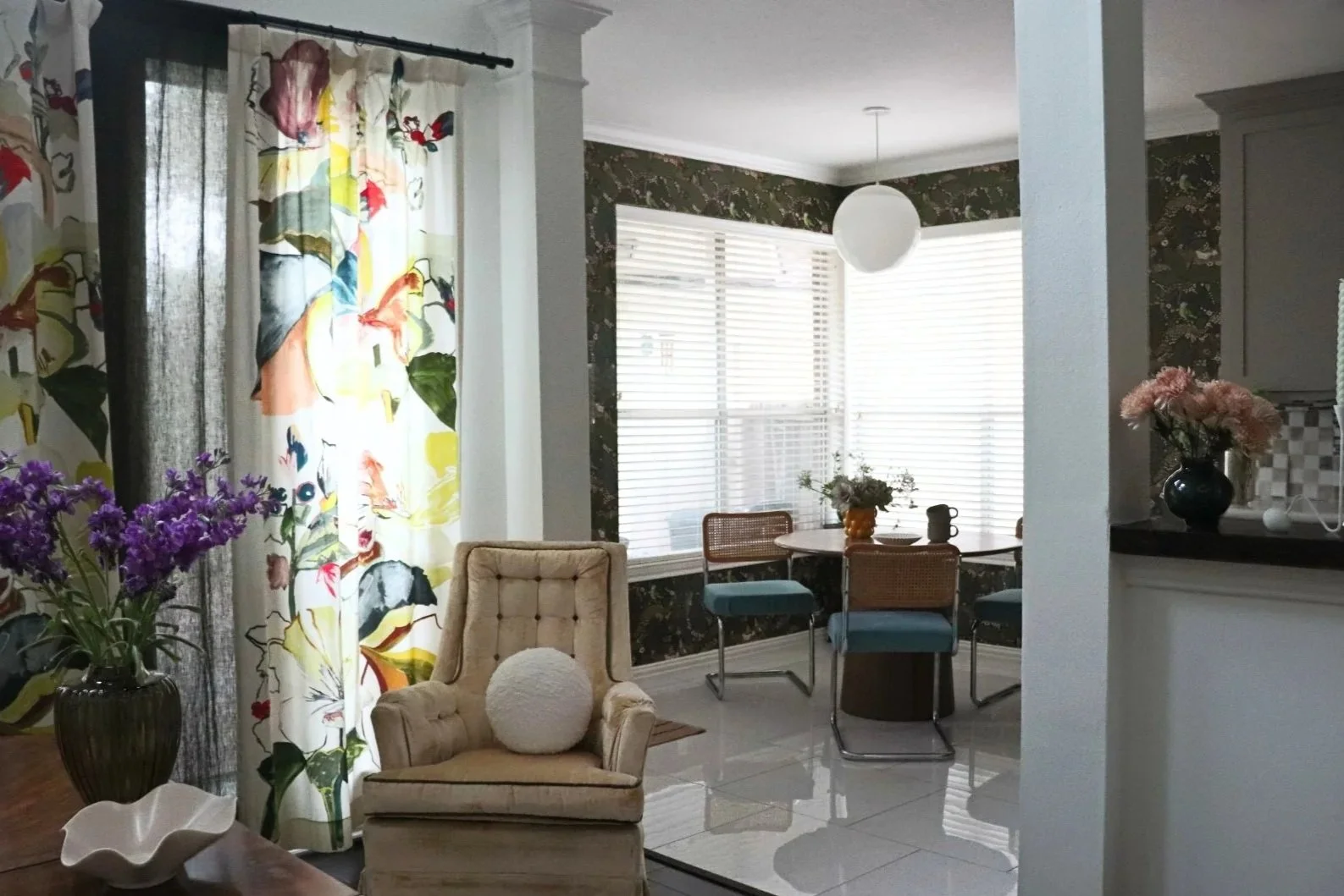 Matiz project dining room featuring botanical wallpaper and custom breakfast nook textiles.