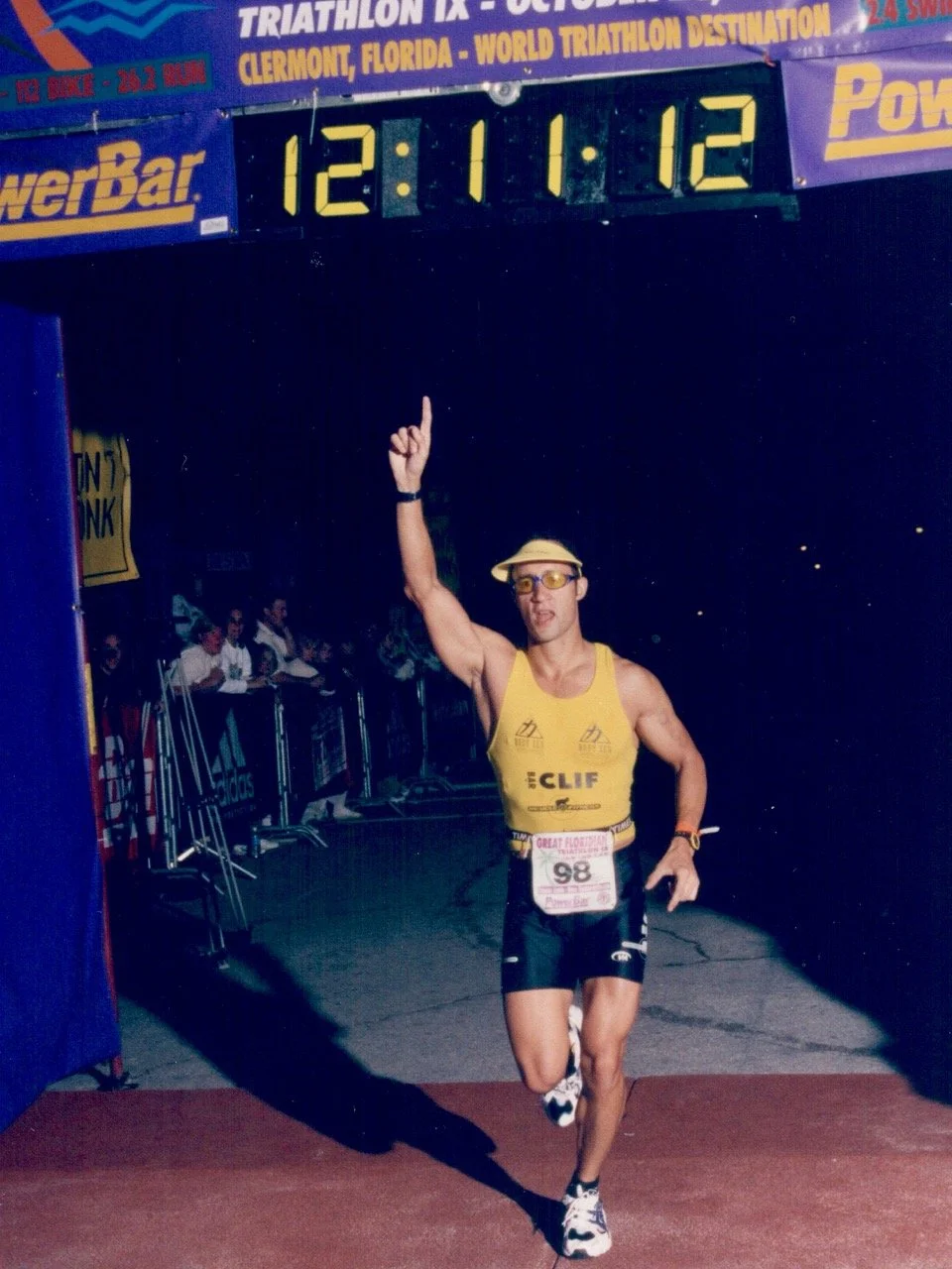 Crossing the finish line at Ironman