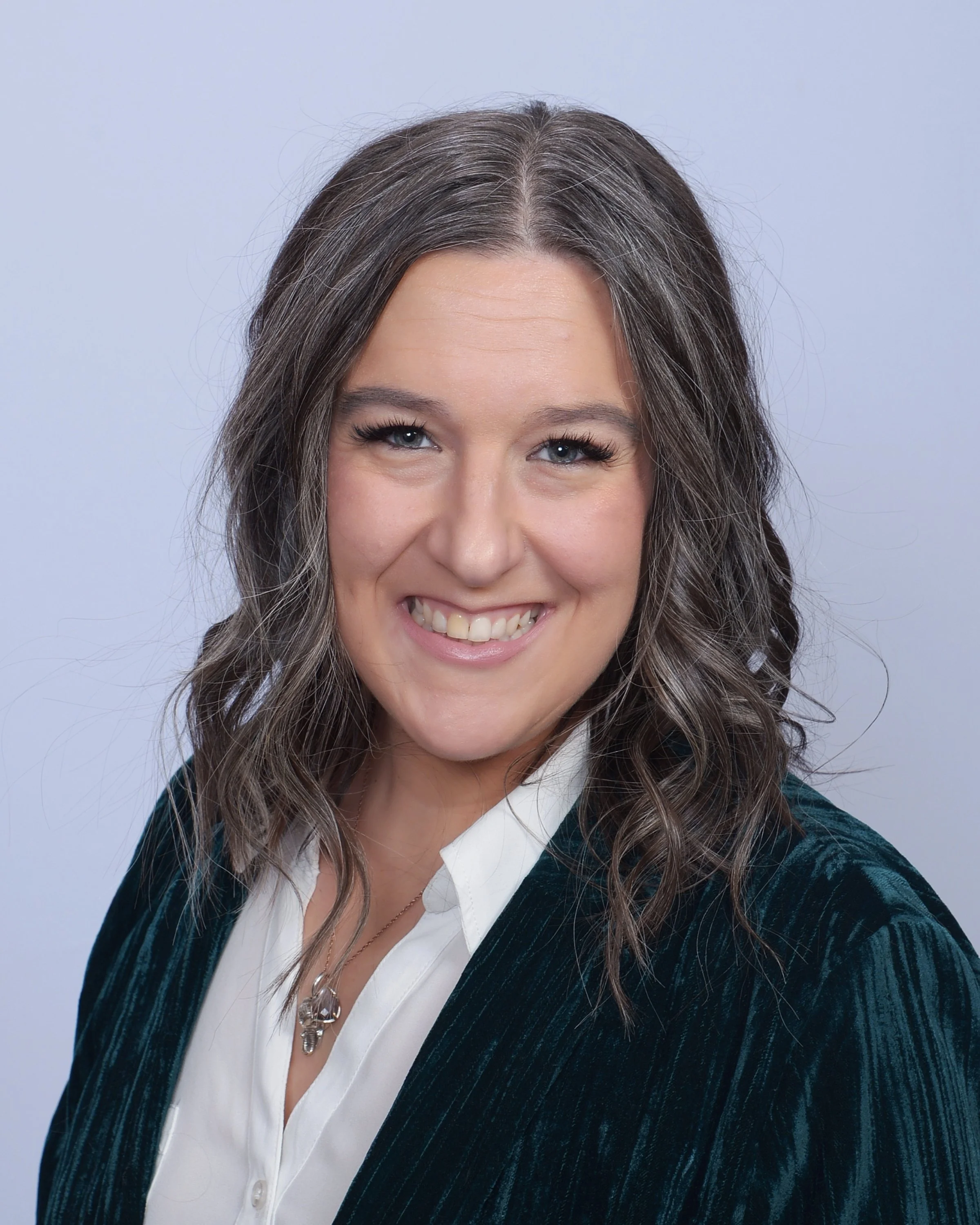 A woman smiles kindly about gestational surrogacy and the compensation benefits available for surrogate mothers at Bright Futures Families.