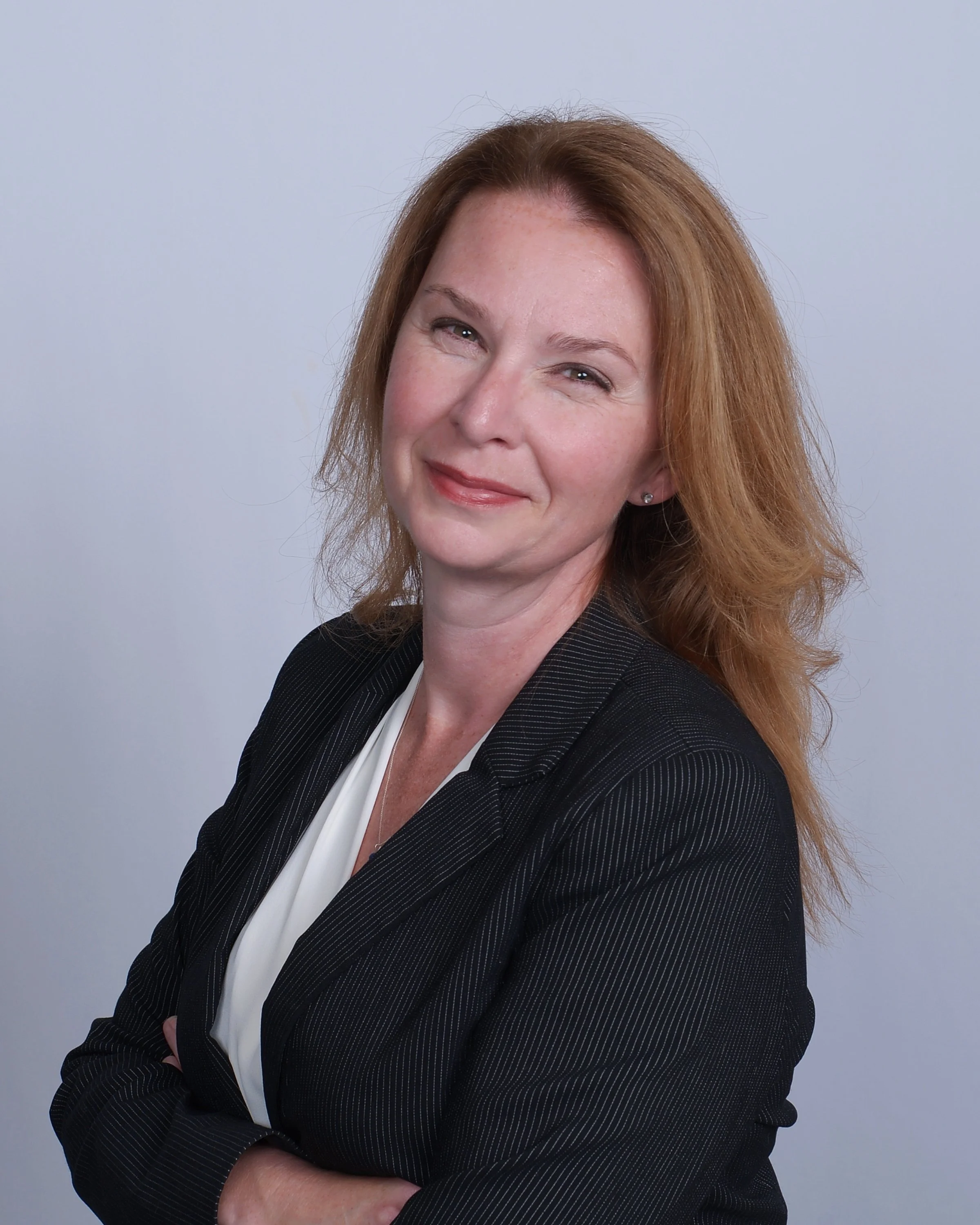 A woman smiles kindly about gestational surrogacy and the compensation benefits available for surrogate mothers.