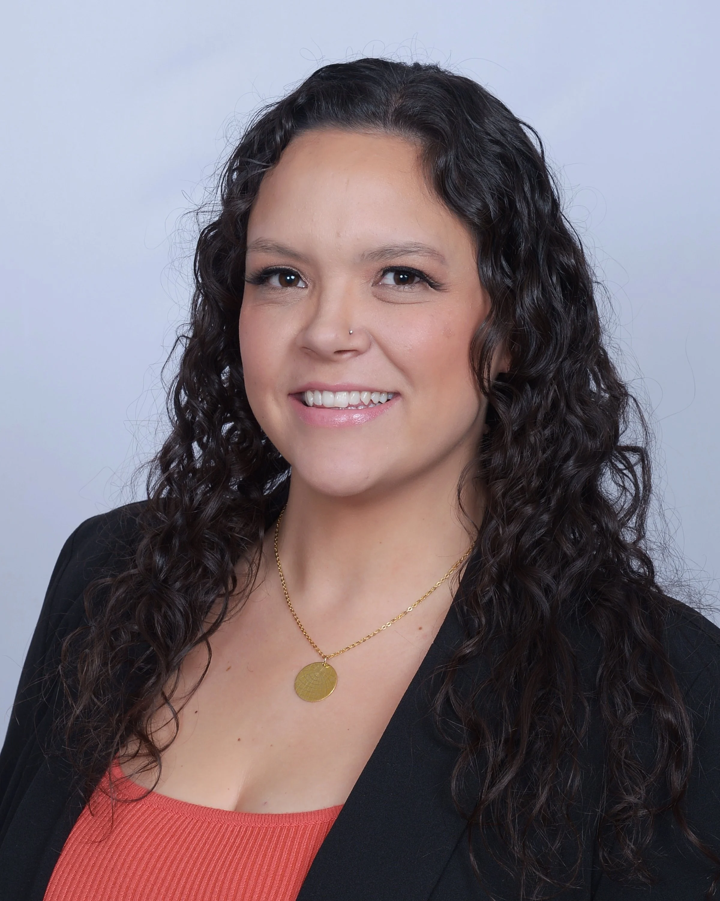 A woman smiles kindly about gestational surrogacy and the compensation benefits available for surrogate mothers at Bright Futures Families.