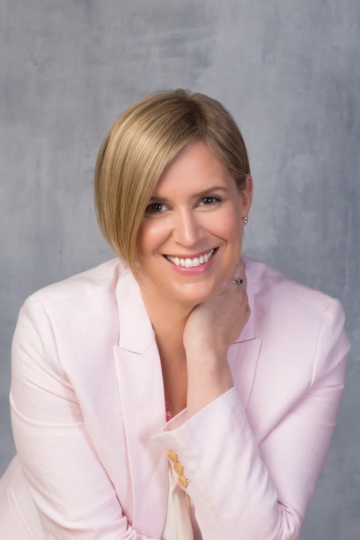 A woman smiles kindly about gestational surrogacy and the compensation benefits available for surrogate mothers at Bright Futures Families.