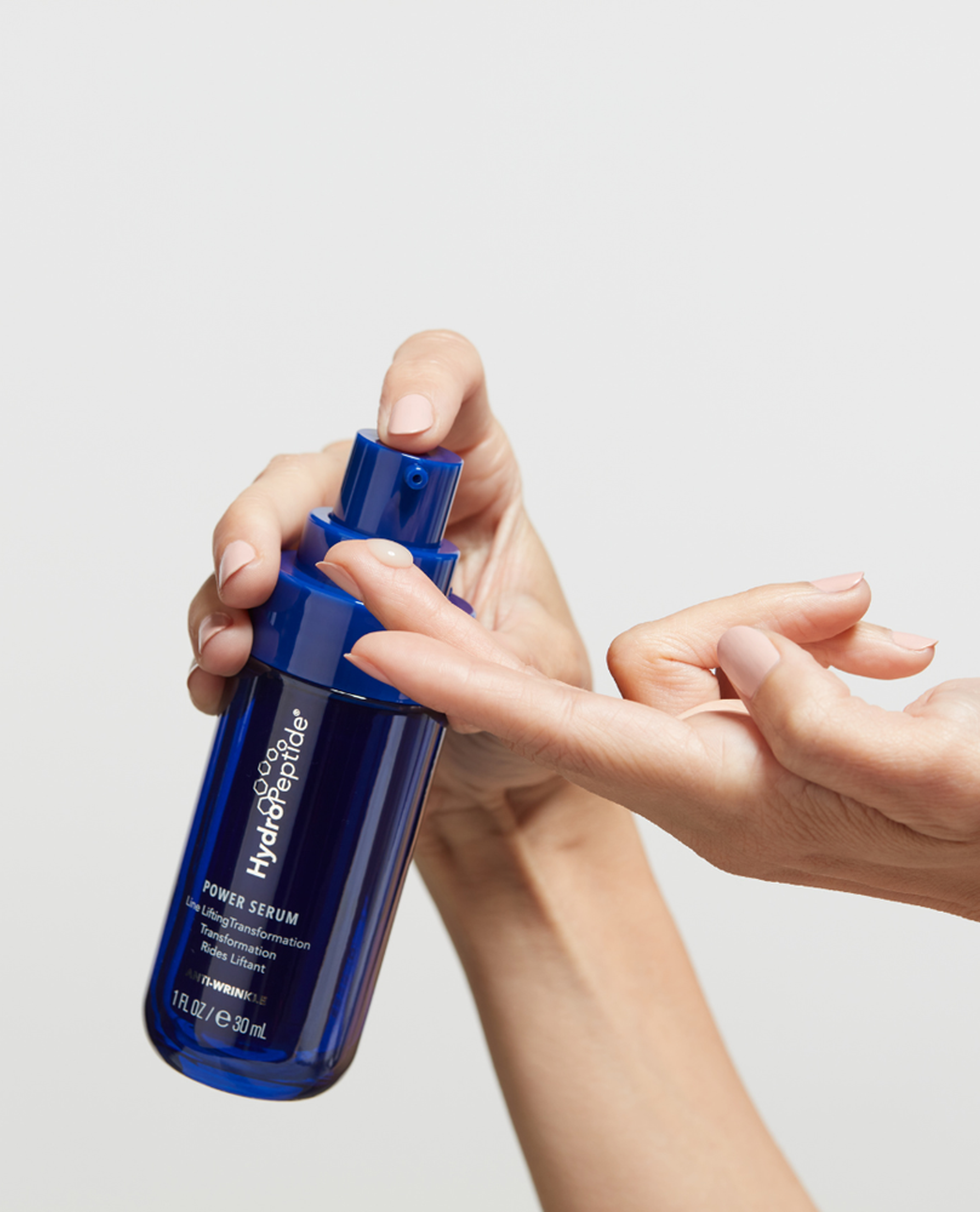 SKNJECT---HydroPeptide-Power-Serum-Hand.png