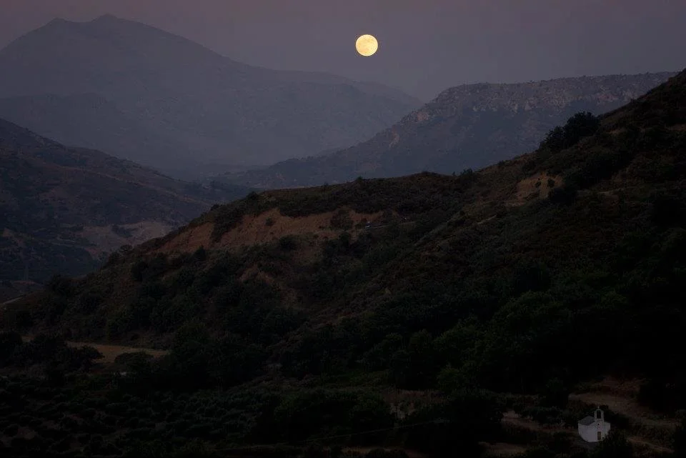 The Full Moon over the mountains