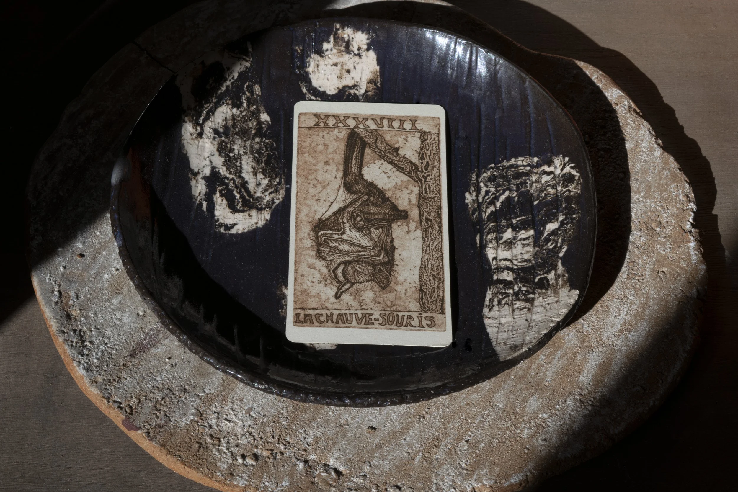 tarot card pull lying on nerikomi plate 