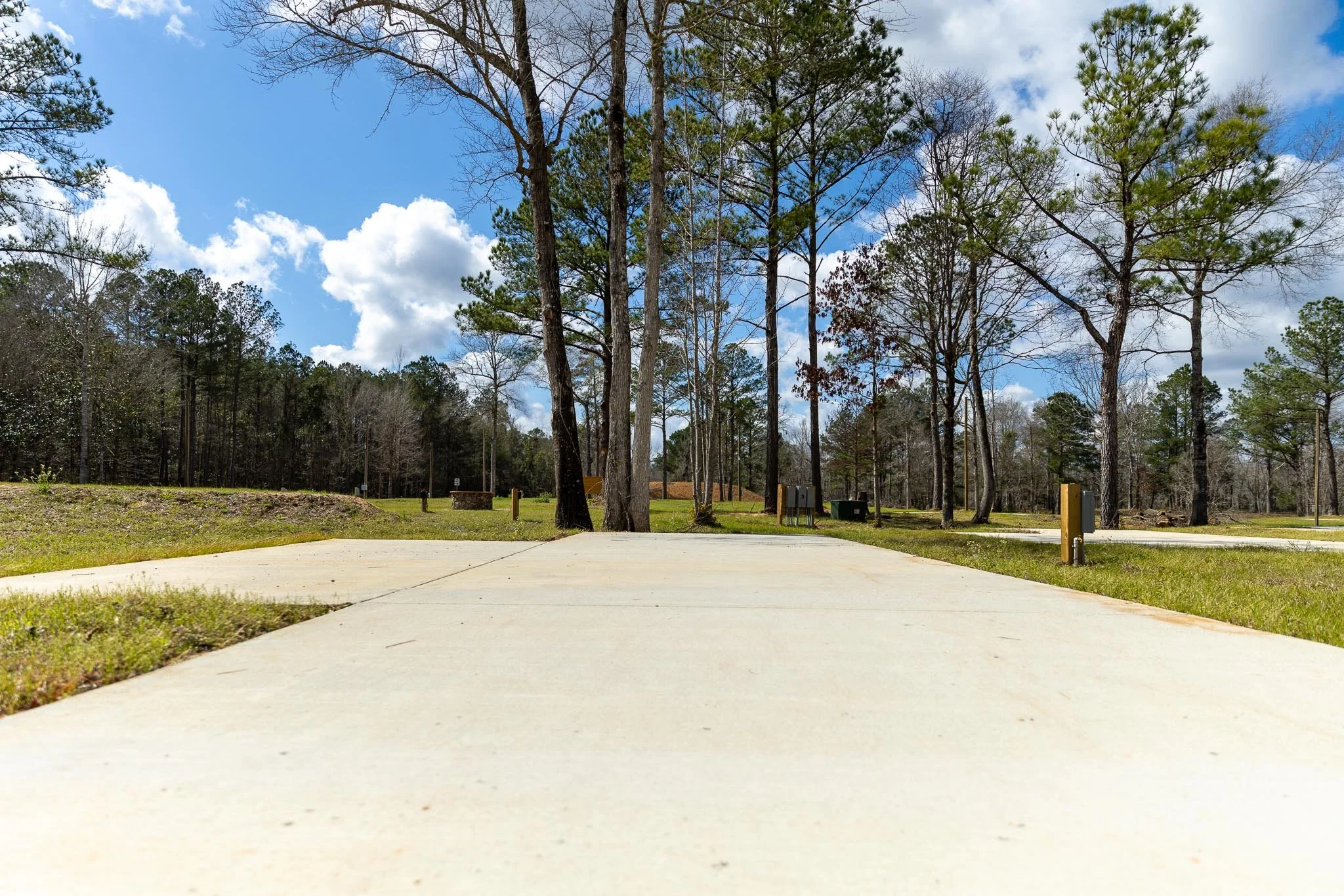 A close-up shot of an RV pad at Chumuckla Springs RV Resort in Jay, FL