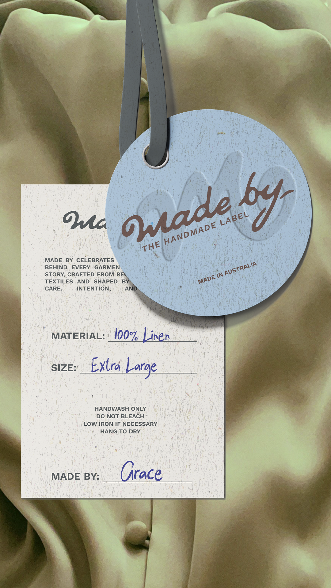 Clothing label attached to a beige silk garment, indicating it is handmade from 100% linen, extra large size, made in Australia, and crafted by Grace.