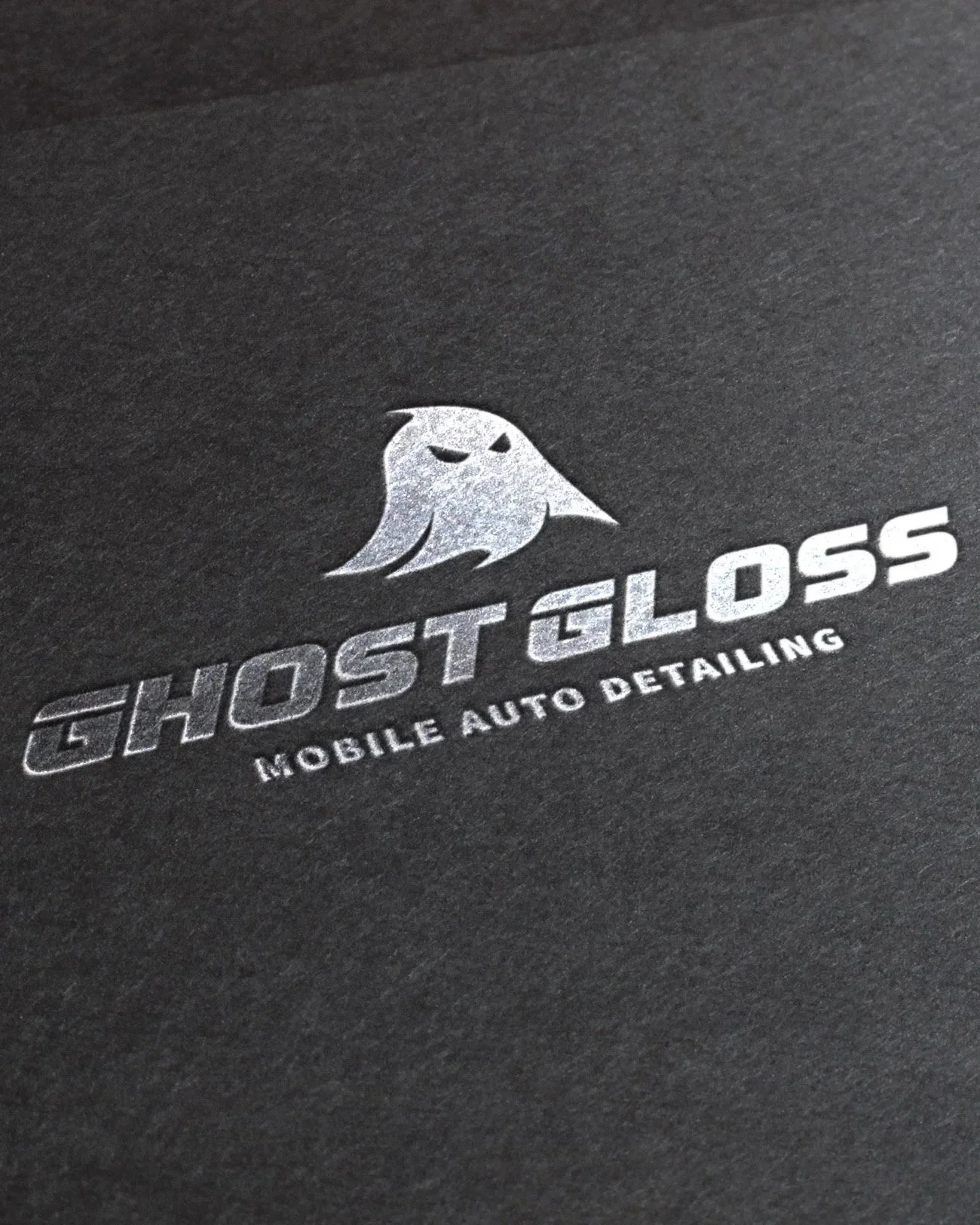 Black background with a silver ghost logo and the text 'GHOST GLOSS' and 'MOBILE AUTO DETAILING'.