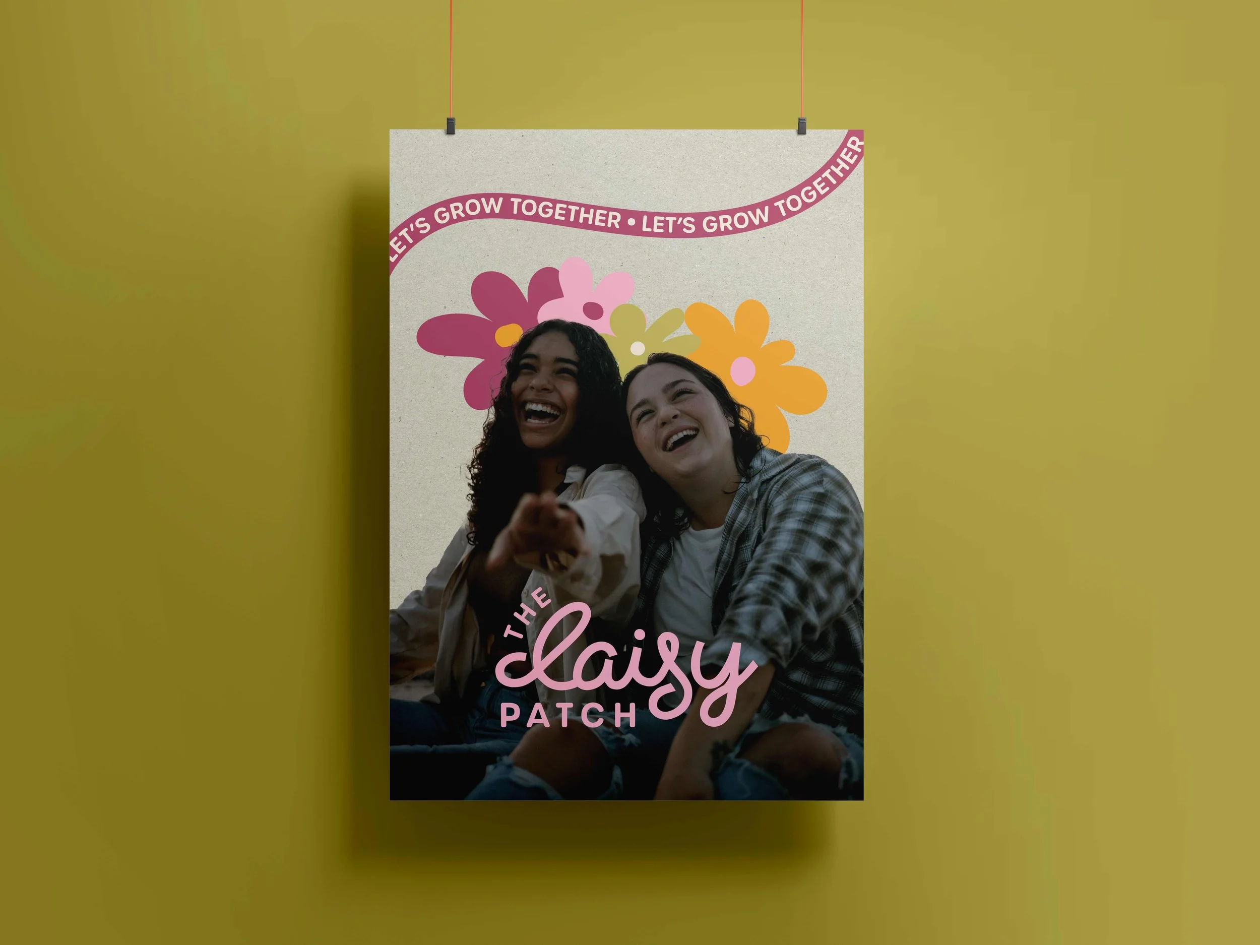 A poster showing two women laughing and smiling, with colorful flower illustrations and text that reads 'Let's grow together - Let's grow together' at the top and 'The Daisy Patch' at the bottom.