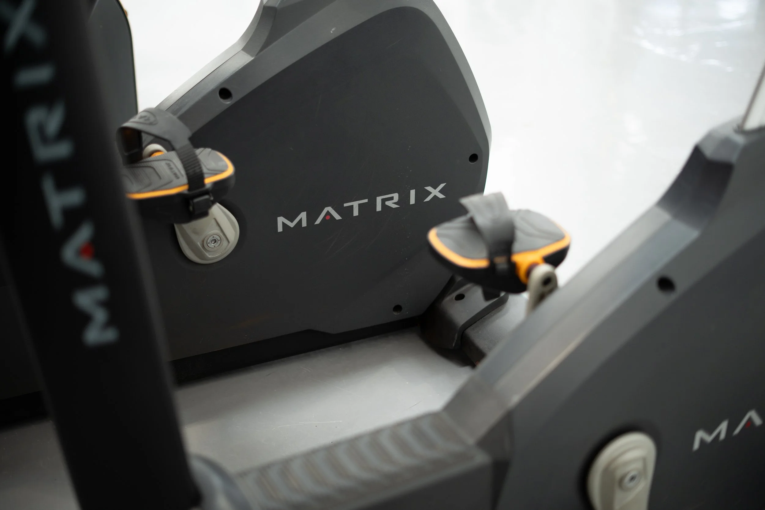 Close-up of a black electric skateboard with the word
