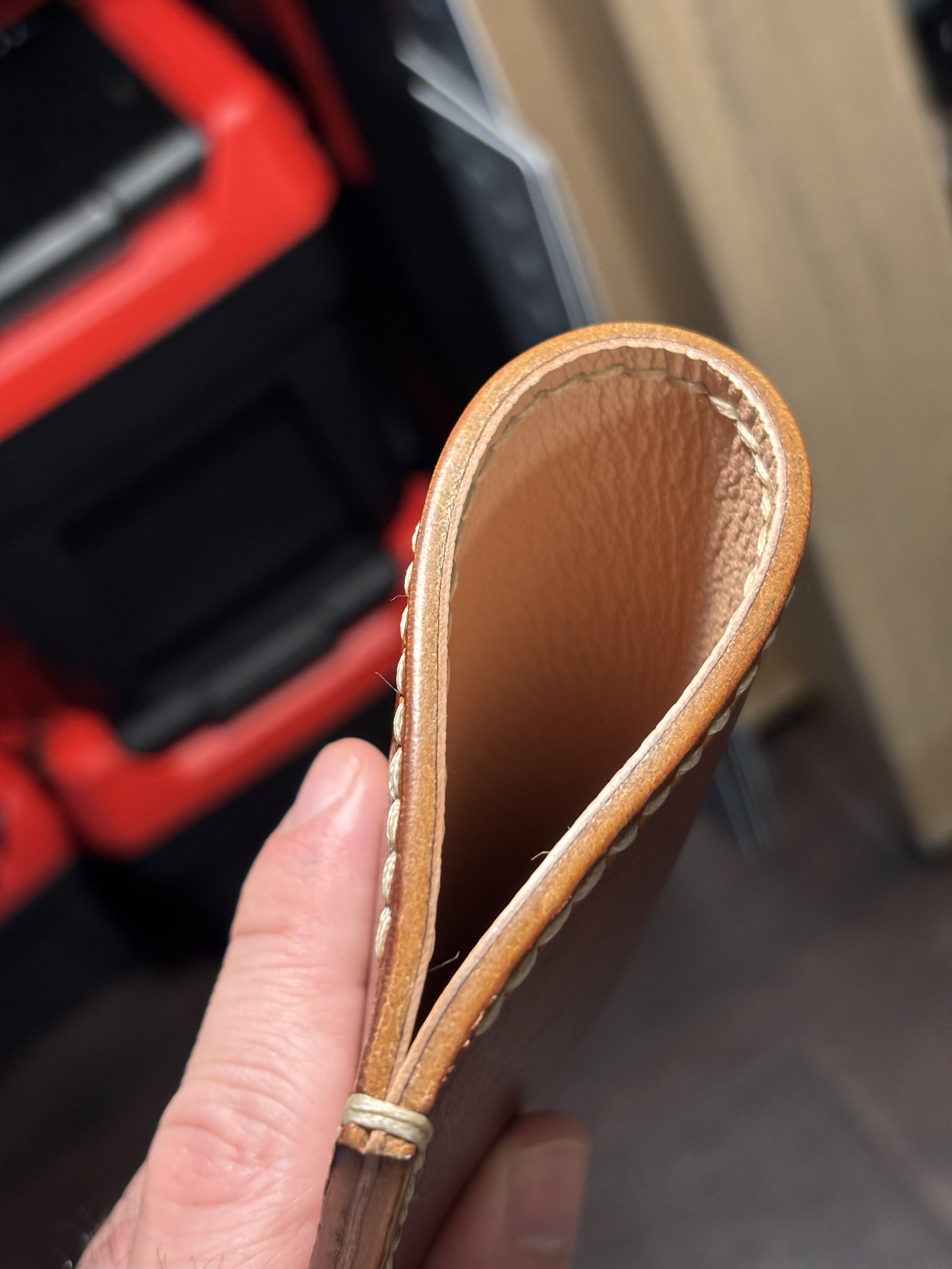 French Alran chevre goatskin lining and hand-burnished edge detail on The Drifter Horween Dublin leather glasses sleeve.